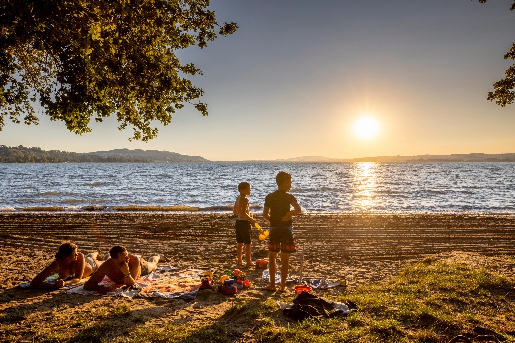 Family on a beach at sunset
