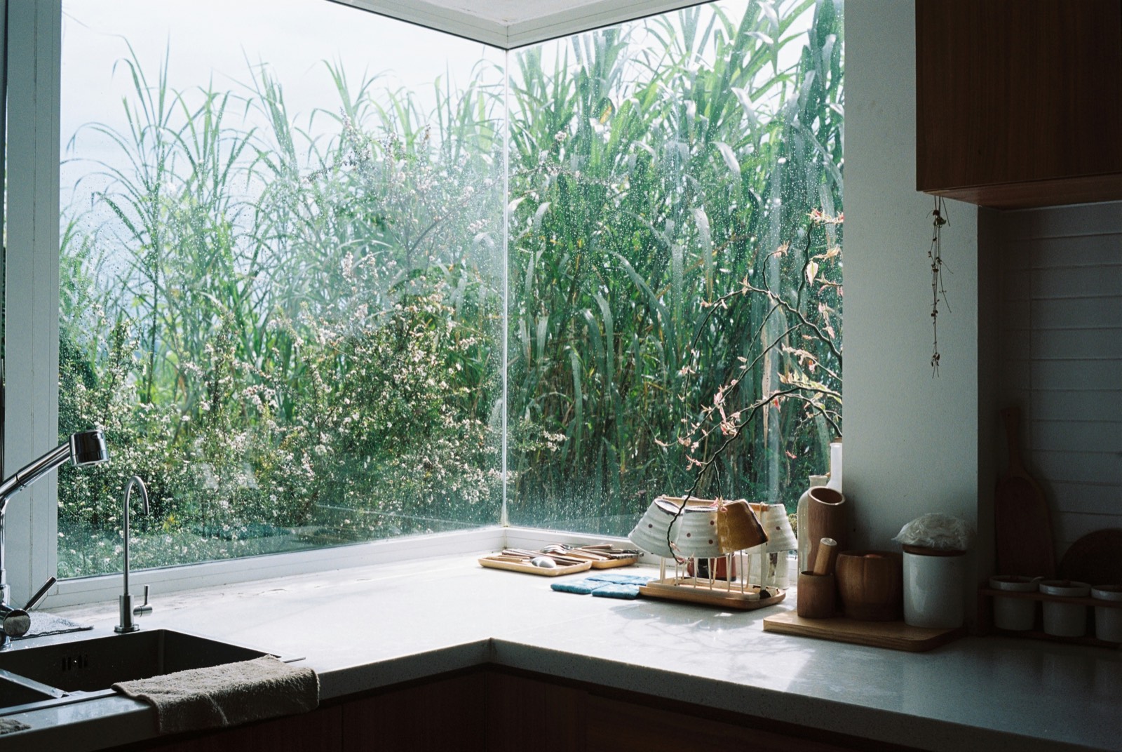 Kitchen counter beside a corner window