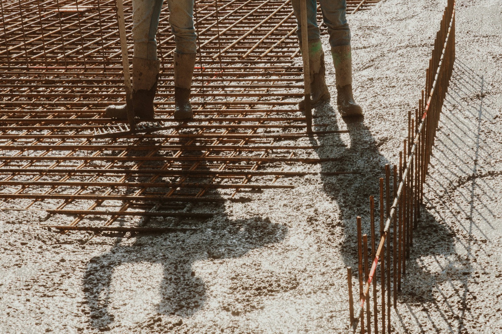 Boots on a rebar grid at a pour