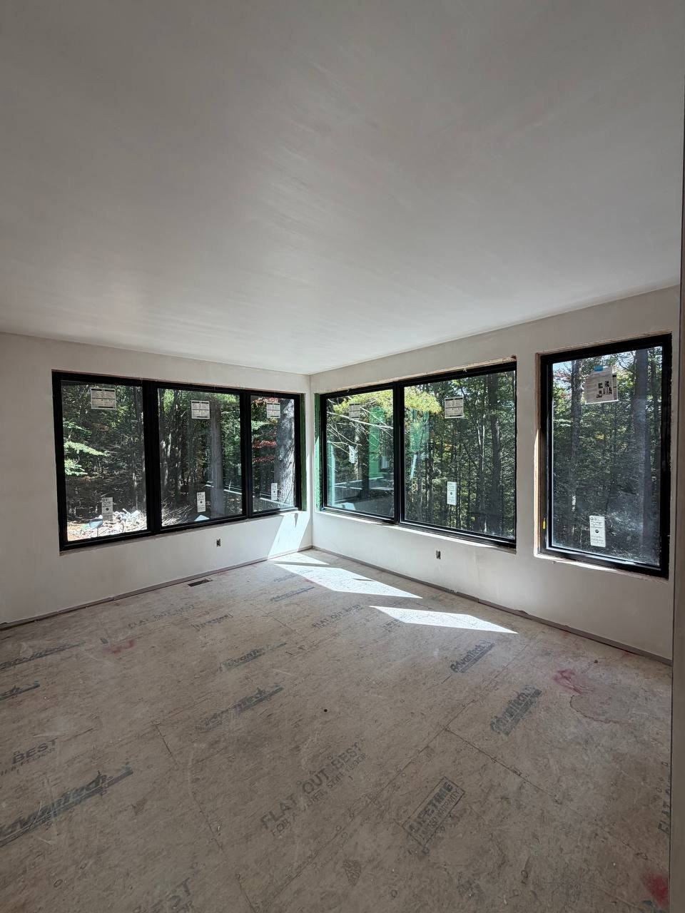 Upper room with windows looking into the woods