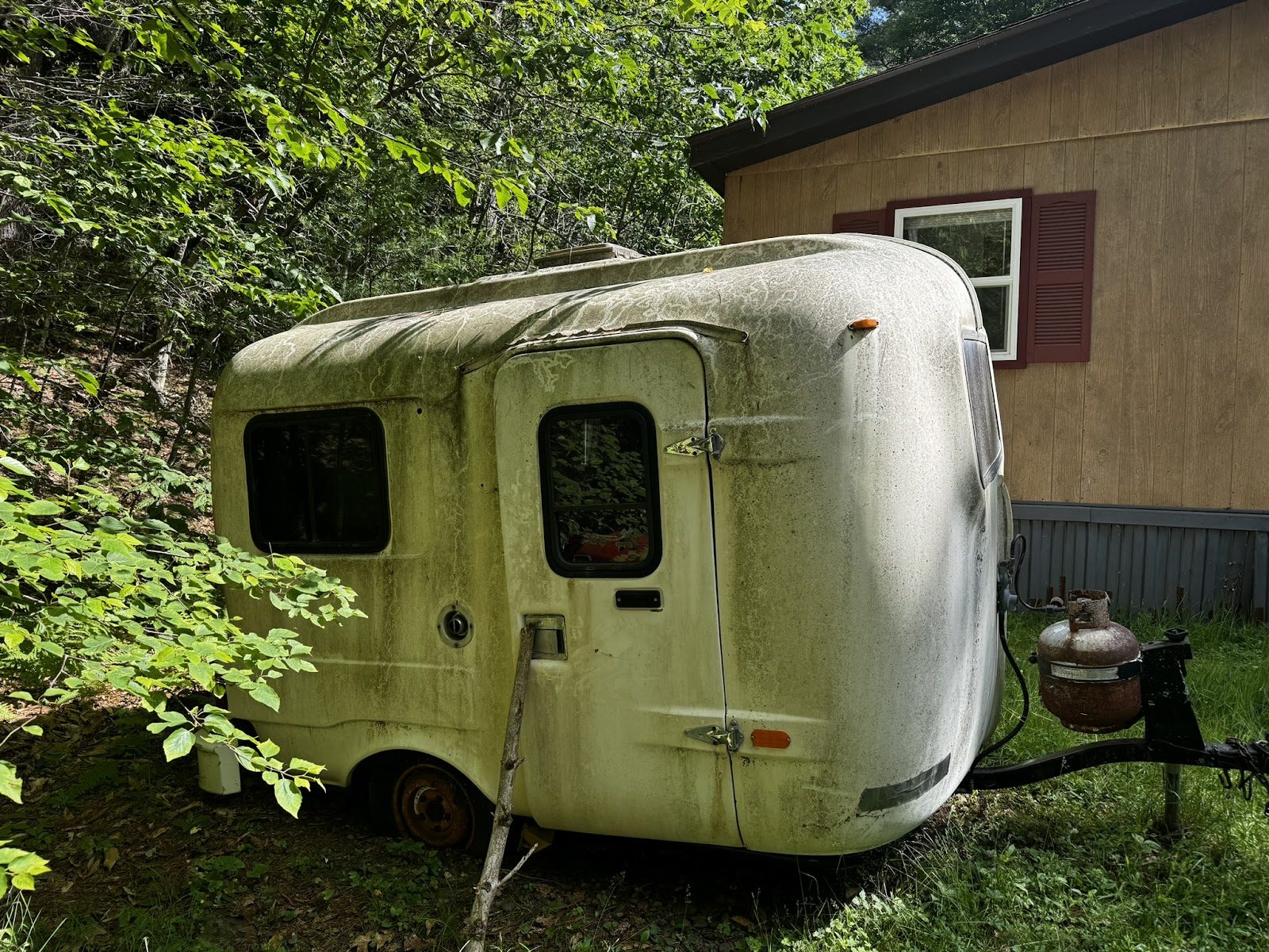 Trailer beside the existing house