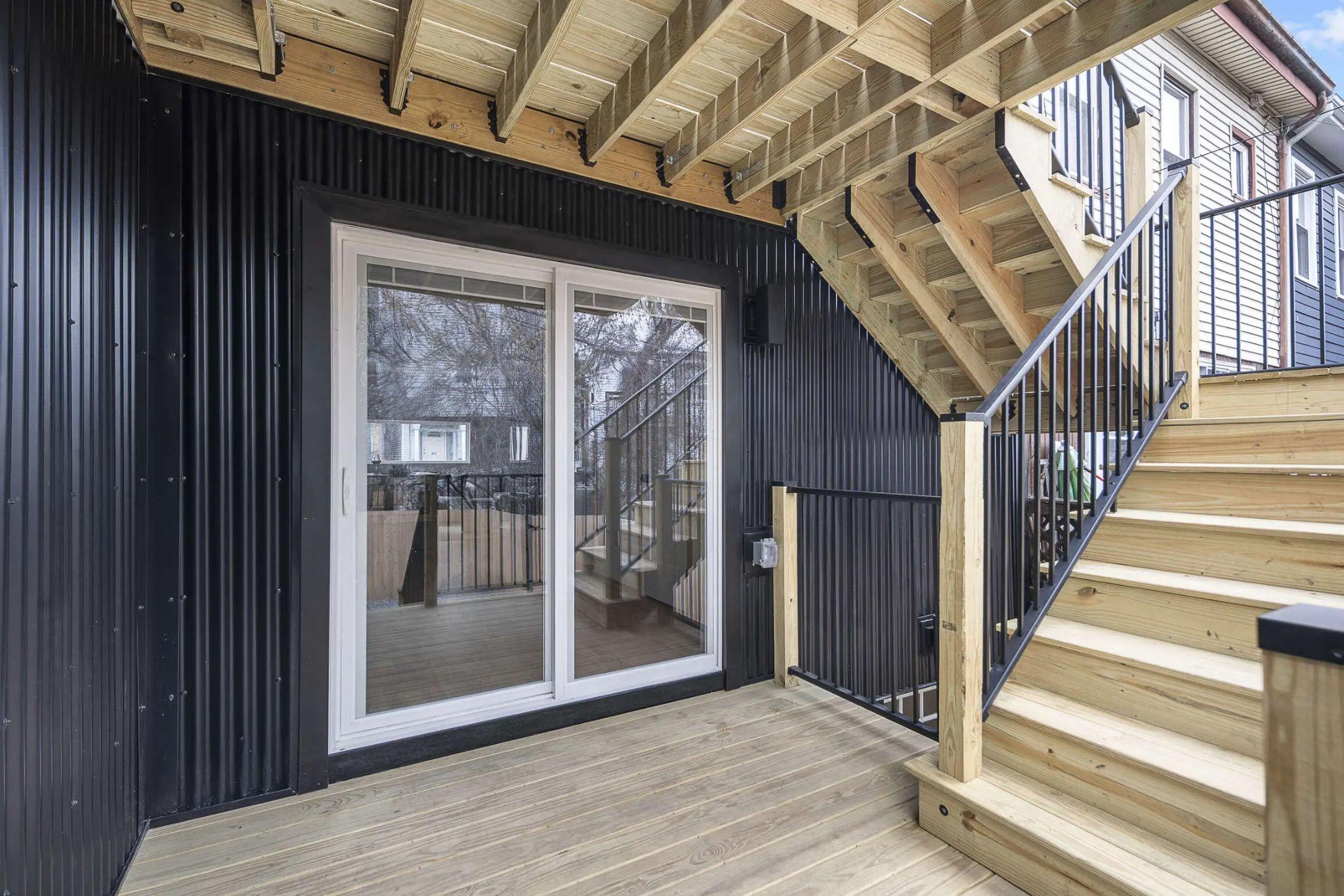 Rear sliding door, deck, and stairs