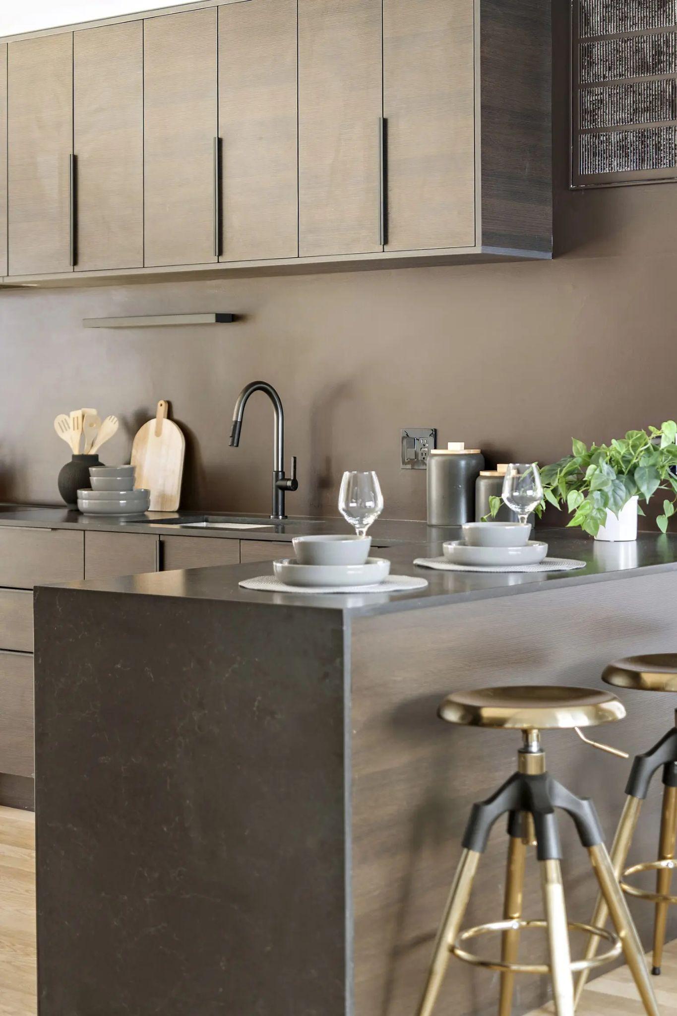 Kitchen island and dark cabinetry
