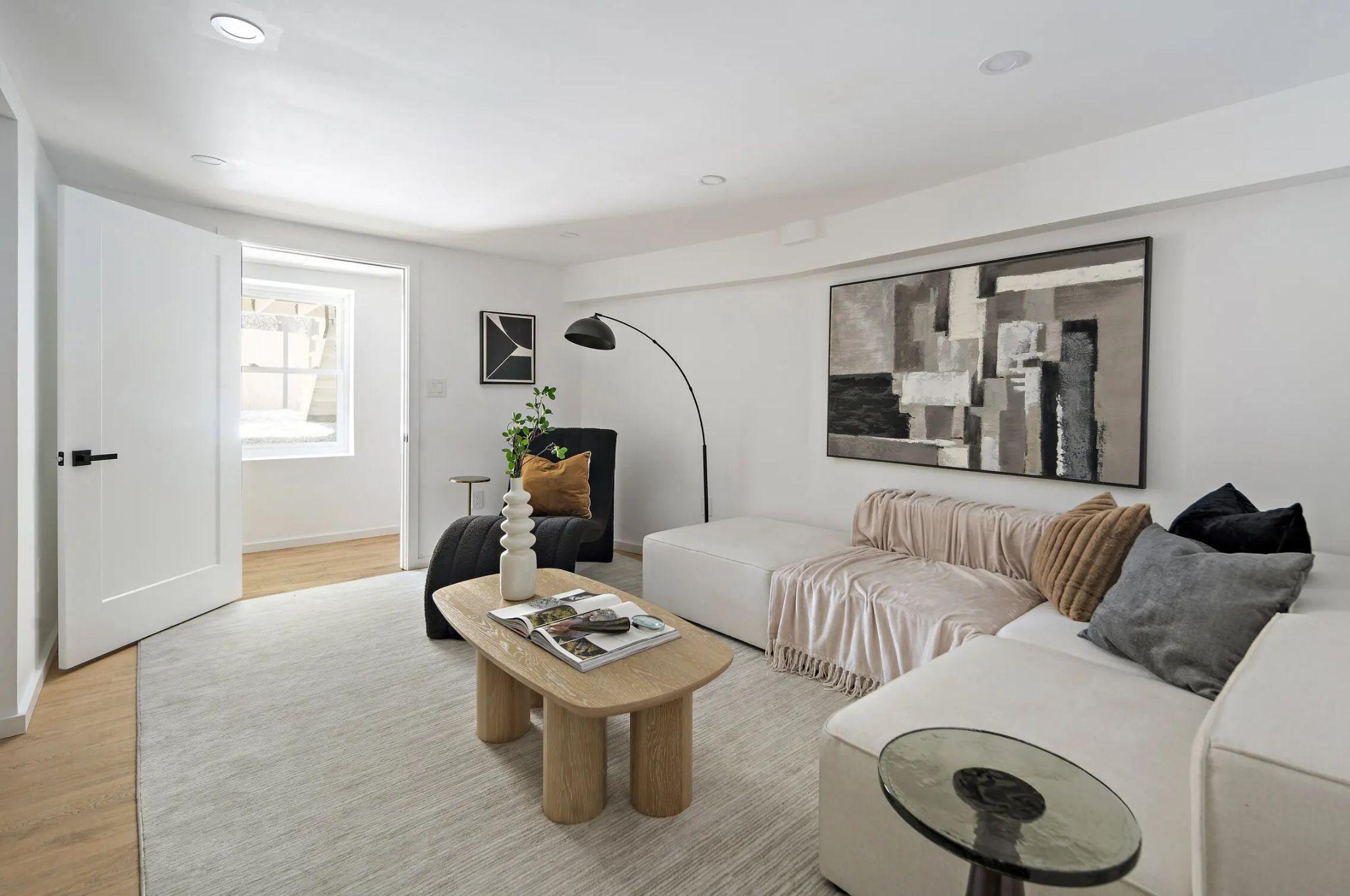 Lower residence living room, white walls and white oak floor