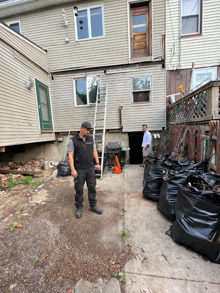 The rear yard before work, with the old house still standing